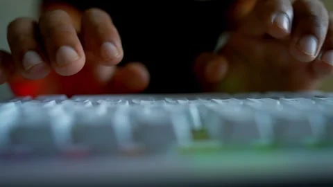 Close-up of hands typing on a white keyboard in an office setting Stock Footage 315981301