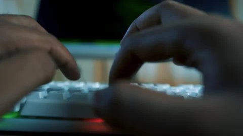 Close-up of hands typing on a white keyboard with a blurred background Stock Footage 315981547