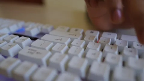 Close-up of hands typing on a white keyboard Stock Footage 318578021
