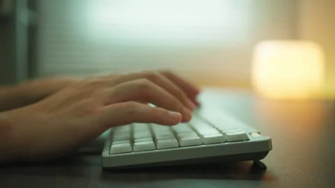 Close-up of Hands Typing on White Keyboard. Stock Footage 336717115