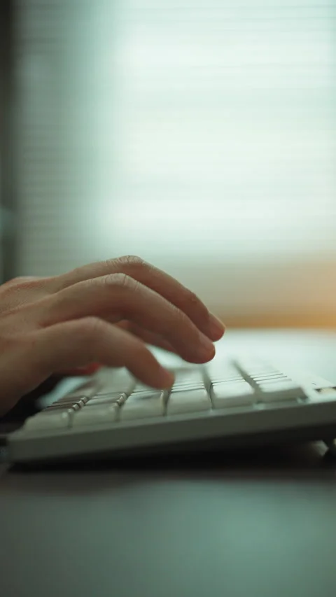 Close-up of Hands Typing on White Keyboard. Stock Footage 336717122
