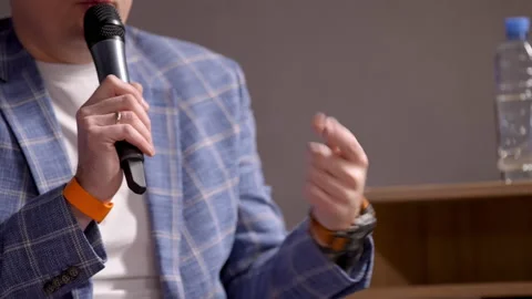 Close-up hands of unknown business trainer giving presentation to group of Stock Footage 166966835