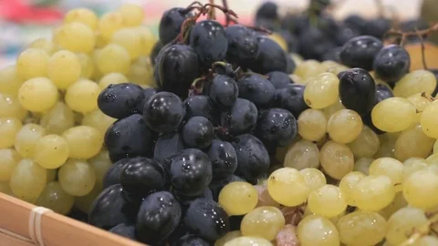 Close-up of hands unknown person taking grapes Видео 83055795