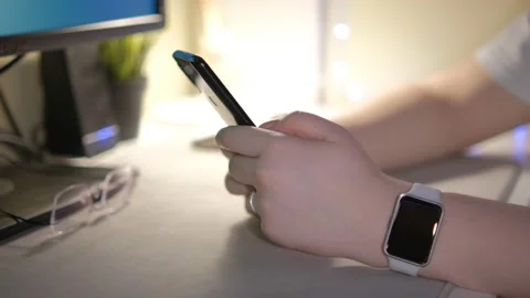 Close-up hands of unrecognizable businessman using mobile phone sitting at desk Stock Footage 236347466