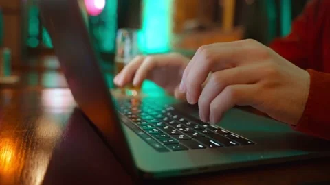 Close-up of the hands of an unrecognizable guy typing on a computer keyboard. Stock Footage 231690740