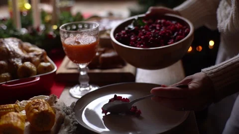 Close-up hands of unrecognizable happy young woman putting salad on plate Stock Footage 163819991