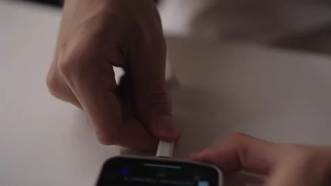 Close-up hands of unrecognizable man connecting OTG cable to smartphone Stock Footage 318470185