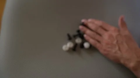 Close-up hands of unrecognizable man pouring out screws and fittings from Stock Footage 290167592