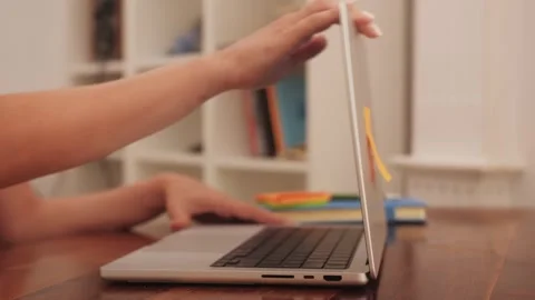 Close-up of hands of unrecognizable person turning off laptop and closing lid of Stock Footage 264946934