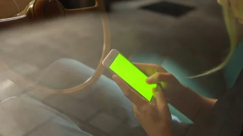 Close up hands use smartphone in vintage car on parking green screen chroma 5g  Stock Footage 112349509