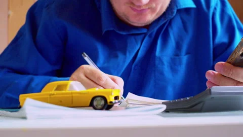 Close up of hands using calculator and holding smartphone Stock Footage 337668720