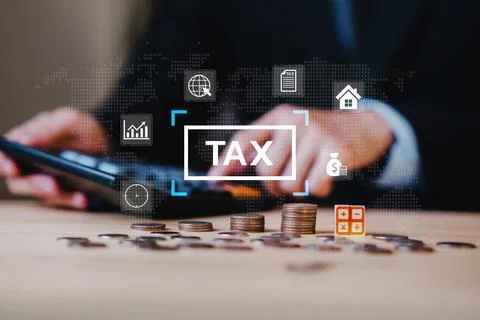 Close up of hands using calculator with stacked coins and tax icon, represe.. Stock Photos