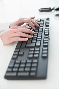 Close up of hands using computer keyboard 写真素材
