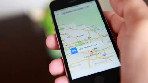Close-Up Of Hands Using Google Maps In Smart Phone Stock Footage 55551770