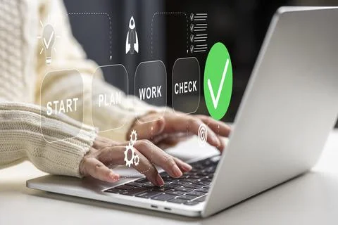 Close-up of hands using a laptop with an interface overlay displaying the s.. Stockfoto's
