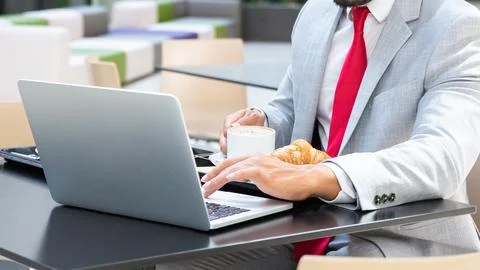 Close-Up Hands Using Laptop for Online Work and Business Stock Photos