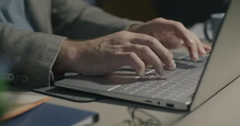 Close-up of hands using laptop working at program development at desk in office Video stock 253466977
