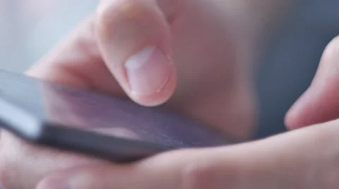 Close-up hands using mobile phone touchscreen Stock Footage 68754053
