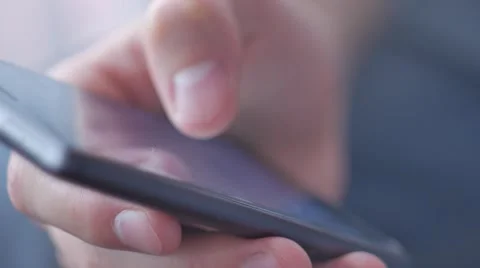 Close-up hands using mobile phone touchscreen Stockbeeldmateriaal 68872222