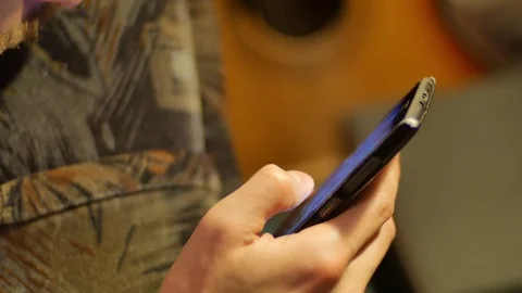 Close-up hands using mobile phone touchscreen scroll up and down Stock Footage 72460115