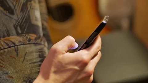 Close-up hands using mobile phone touchscreen scroll up and down an push button Stock Footage 72516400