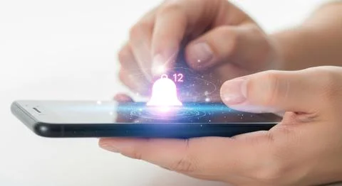 Close up hands using modern smartphone with glowing digital effects on screen Stock Illustration