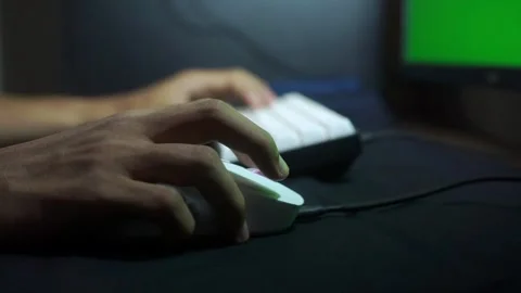 Close-up of hands using a mouse next to a keyboard. Concept of technology Stock Footage 322159689