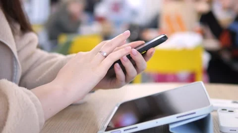 Close-up of hands using phone and laptop Stock Footage 342028402