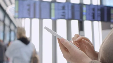 Close-up of hands using phone near airport Stock Footage 342070275