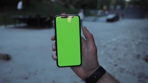 Close up hands using phone with vertical green screen smart mobile playground Video stock 111593539