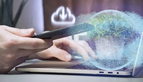 Close-Up of Hands Using a Smartphone and Laptop with a Futuristic Digital C.. Stock Photos