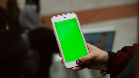 Close up hands using smartphone with green screen in a shopping mall finger Stock Footage 105204076