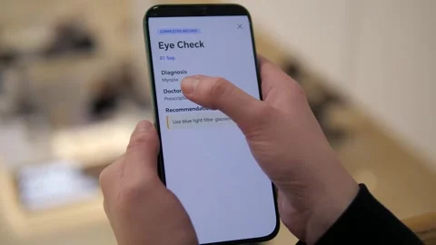 Close-up of hands using a smartphone health log app Vídeos de archivo 328567341