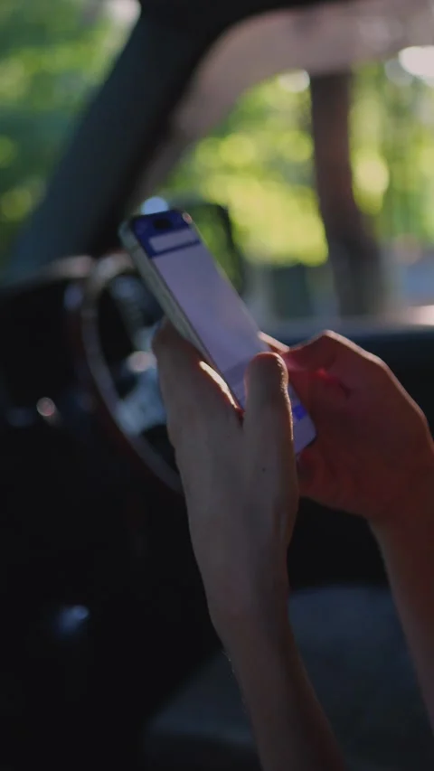 Close-up of hands using a smartphone inside a car with... Stock Footage 341613243
