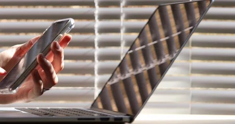 Close up of hands using smartphone in modern office interior, mobile internet Stock Footage 107314304
