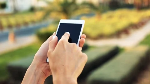 Close up of hands using smartphone touchscreen outdoors Stock Footage 332015190
