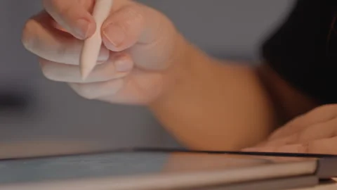 Close up hands using styluses on digital tablets interacting with screens Stock Footage 344405439