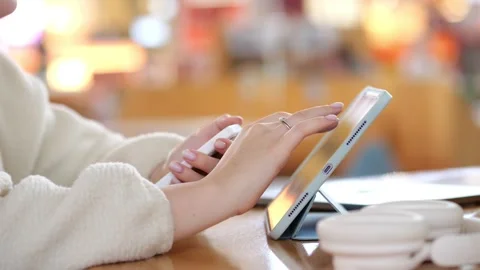 Close-up of hands using tablet with stylus Stock Footage 345697244