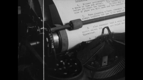 Close up of hands using typewriter and sheets of paper, UK 1945 Stock Footage 133385056