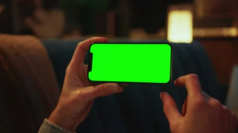 Close up hands using typing on a mobile phone with a horizontal green screen Stock Footage 238744684