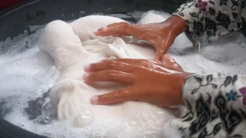 Close up of hands washing clothes Stock Footage 321979205