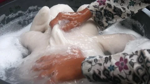 Close up of hands washing clothes Stock Footage 321979210