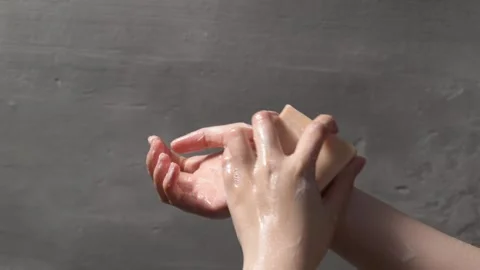 Close up of hands washing with soap creating lather, promoting cleanliness .. Stock Footage 304213309