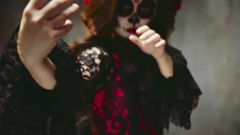 Close-up hands waving beckoning casting spell, portrait woman sugar skull Stock Footage 317226105