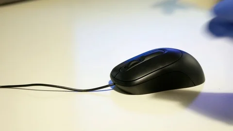 Close up of hands wearing nitrile gloves cleaning a computer mouse. Stock Footage 128323681