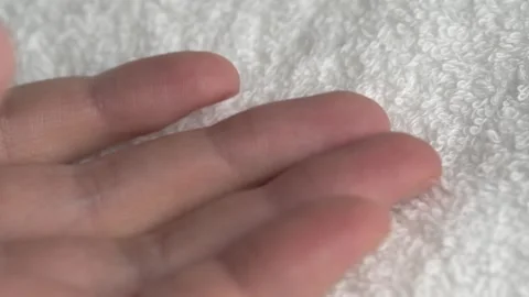 Close-up of hands on white bath towel. Details of a white terry towel. Stock Footage 263190895