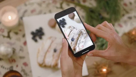 Close up hands woman hold phone taking picture of tasty dessert. Christmas time Stock Footage 144962753