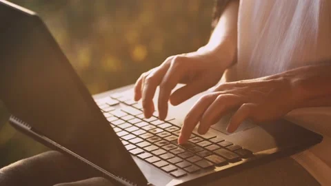 Close-up hands of woman typing fast on laptop outdoors. 스톡 동영상 239264867