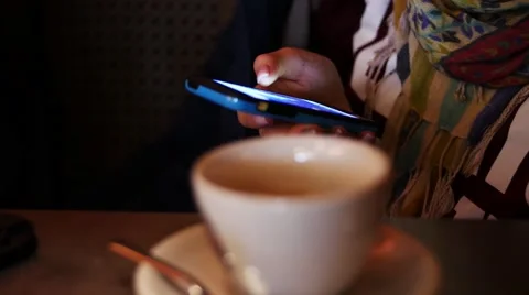 Close up of hands woman using her cell phone in restaurant, cafe Stock Footage 61520209