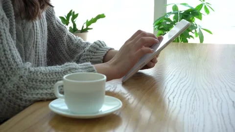 Close up of hands woman using her tablet pc in cafe Stock Footage 171454215